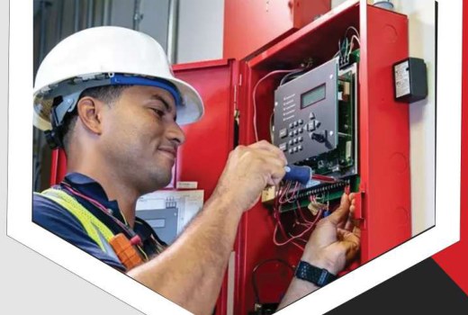 Technician working on a fire safety control system